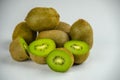 Sliced fresh and juicy kiwi fruit halves on a wooden background Royalty Free Stock Photo