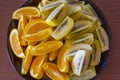 Sliced Fresh Orange and Golden Kiwi Fruit on a Plate; Auckland New Zealand Royalty Free Stock Photo