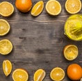 Sliced fresh oranges, lined frame wooden rustic background top view close up Royalty Free Stock Photo