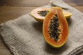 Sliced fresh papaya on wooden background Royalty Free Stock Photo