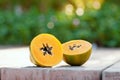 Sliced fresh papaya on a wooden background on the street Royalty Free Stock Photo