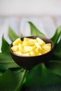 Sliced fresh pineapple in a bowl on the leaves Royalty Free Stock Photo