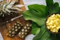 Sliced fresh pineapple in a bowl on the leaves Royalty Free Stock Photo