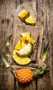 Sliced fresh pineapple with a knife on a chopping Board. Royalty Free Stock Photo