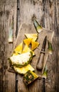 Sliced fresh pineapple with a knife on a chopping Board. Royalty Free Stock Photo