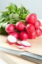 Sliced fresh radishes with a knife