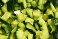 Sliced fresh raw cucumber, cubes, heap, background Royalty Free Stock Photo