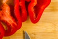 sliced fresh red paprika, bell pepper on bamboo cutting board Royalty Free Stock Photo