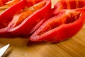 sliced fresh red paprika, bell pepper on bamboo cutting board Royalty Free Stock Photo