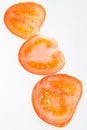 Sliced fresh red tomatoes isolated on the white background Royalty Free Stock Photo