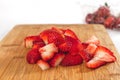 Sliced Fresh Ripe Strawberries on a Chopping Board Ready to be Served Royalty Free Stock Photo