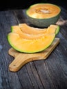 Sliced fresh sweet melon on wooden board. Sweet fruit Royalty Free Stock Photo