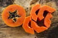 Sliced of fresh sweet papaya on wooden background Royalty Free Stock Photo