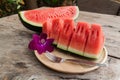 Sliced Fresh water melons on wood plate Royalty Free Stock Photo