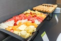 Sliced fruits and Sweet muffins on served table on a coffee break in the office Royalty Free Stock Photo