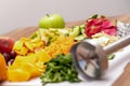 Sliced fruits and vegetables for smoothies. Banana, pitahaya and others, close-up, on a wooden table