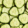 Sliced gherkin. Fresh slices of cucumber as background Royalty Free Stock Photo