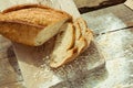 Sliced gluten free bread on wooden table.