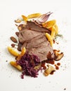 Sliced gourmet wild venison roast with vegetables