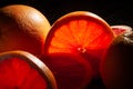 sliced grapefruit on black Royalty Free Stock Photo