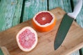 Sliced grapefruit on cutting board Royalty Free Stock Photo