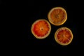 Sliced grapefruit half isolated on black background., copy space Royalty Free Stock Photo