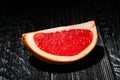 sliced grapefruit on wood Royalty Free Stock Photo