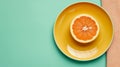 Sliced grapefruit on a yellow plate on a green background