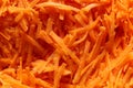 Sliced grated carrot for salad closeup