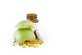 SLICED GREEN APPLE WITH CAPSULES AND MEDICINE BOTTLE Royalty Free Stock Photo