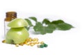 SLICED GREEN APPLE WITH CAPSULES AND MEDICINE BOTTLE Royalty Free Stock Photo