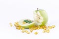 SLICED GREEN APPLE WITH CAPSULES 2 Royalty Free Stock Photo