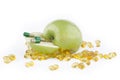 SLICED GREEN APPLE WITH CAPSULES Royalty Free Stock Photo