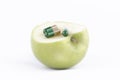 SLICED GREEN APPLE WITH MEDICINE Royalty Free Stock Photo