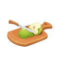 Sliced green apple on a wooden board