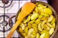 Sliced green apples in a pan to make apple compote