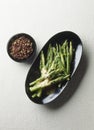 Sliced green asparagus with Sechuan pepper sauce Royalty Free Stock Photo