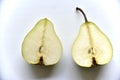 Sliced green pear in half on a white background Royalty Free Stock Photo