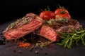 Sliced grilled beef steak with spices on slate slab