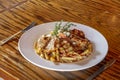 Sliced Grilled Chicken And Creamy Herbed Sauce Over Penne Pasta