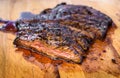 Sliced grilled juicy marinated angus beef flank steak on wooden board Royalty Free Stock Photo