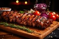 Sliced grilled medium rare beef steak served on wooden board Barbecue, bbq meat beef tenderloin. Top view, slate background Royalty Free Stock Photo