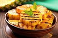 sliced grilled pineapple in a fruit bowl