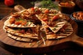 sliced grilled pizza on rustic board