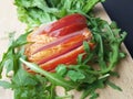 Sliced ham with fresh green lettuce leaves on a cutting board. Royalty Free Stock Photo