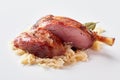 Sliced ham or pork hock on a bed of sauerkraut