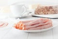 Sliced ham rolled up on white plate Royalty Free Stock Photo
