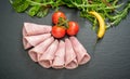 Sliced ham sausage on a stone background Royalty Free Stock Photo