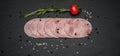 Sliced ham sausage on a stone background Royalty Free Stock Photo