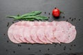 Sliced ham sausage on a stone background Royalty Free Stock Photo